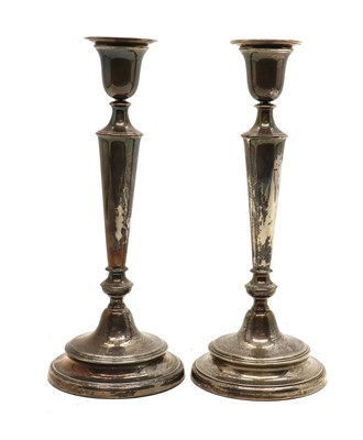Lot 3 - A pair of silver candlesticks