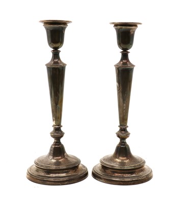 Lot 3 - A pair of silver candlesticks