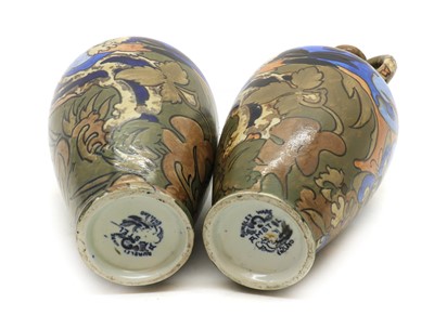 Lot 216 - A near pair of Frederick Rhead Amstel pottery ewers