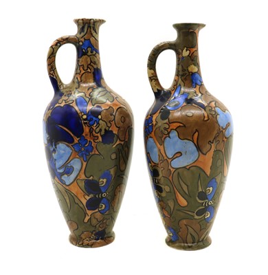 Lot 216 - A near pair of Frederick Rhead Amstel pottery ewers