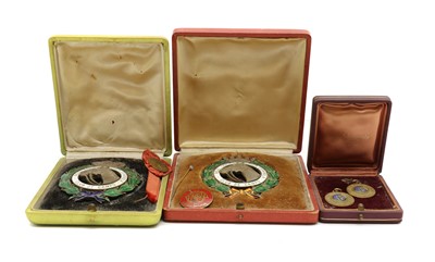 Lot 46 - A cased pair of enamelled Club de Campo medals