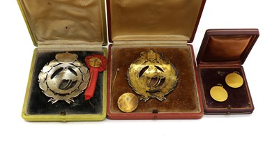 Lot 46 - A cased pair of enamelled Club de Campo medals