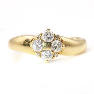 Lot 51 - An 18ct gold four stone diamond quatrefoil cluster ring