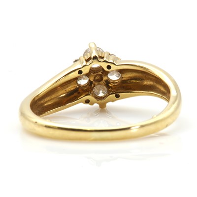 Lot 51 - An 18ct gold four stone diamond quatrefoil cluster ring