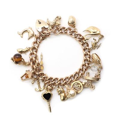 Lot 104 - A gold charm bracelet