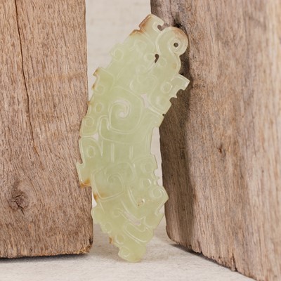 Lot 228 - A Chinese jade pendant