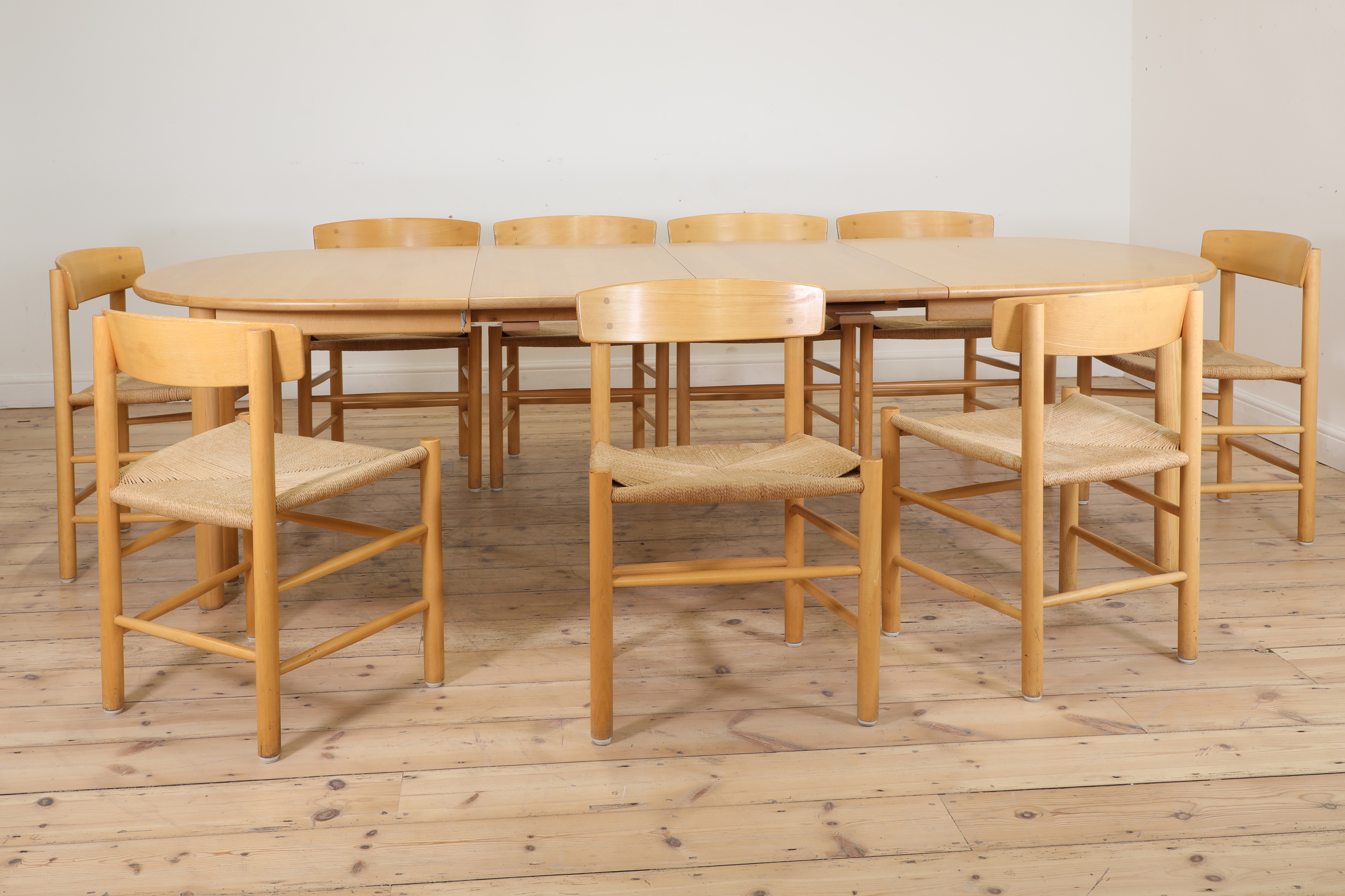 Lot 346 A Danish dining table and nine chairs,