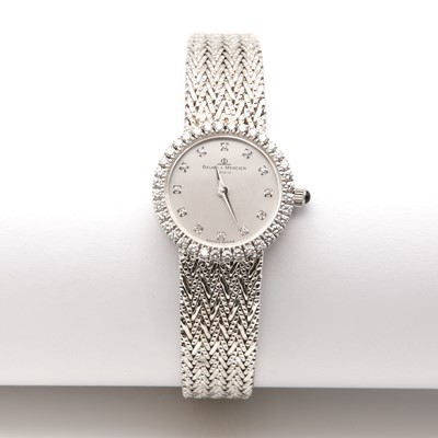 Lot 478 - A ladies' 18ct white gold diamond set Baume & Mercier quartz bracelet watch, c.2008