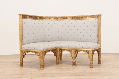 Lot 292 - A carved giltwood Gothic Revival corner settee or banquette