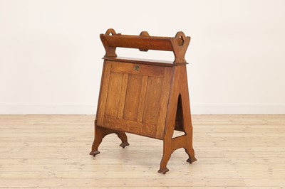 Lot 49 - An Arts and Crafts oak book trough and folio stand