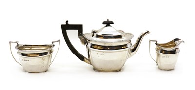Lot 24 - A silver three piece tea set