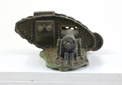 Lot 432 - A 'Starkie's' cast metal World War 1 mark 3 tank and field gun money box