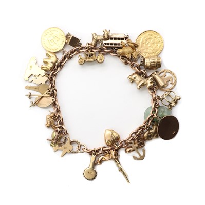 Lot 102 - A gold charm bracelet