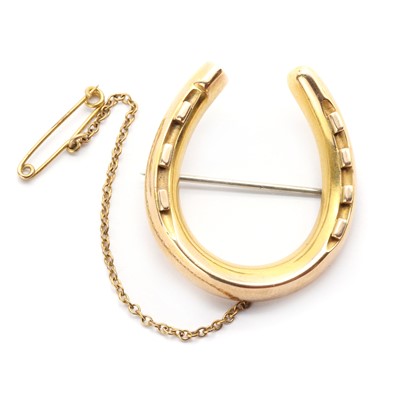 Lot 1026 - A Victorian gold hollow horseshoe brooch