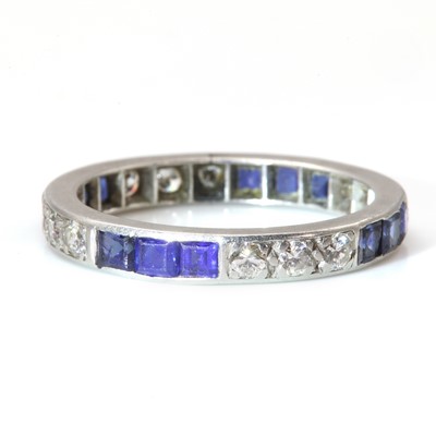 Lot 113 - A sapphire and diamond full eternity ring