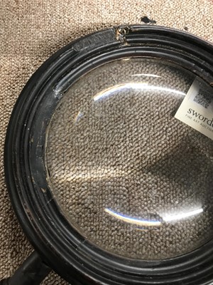 Lot 121 - A magnifying glass