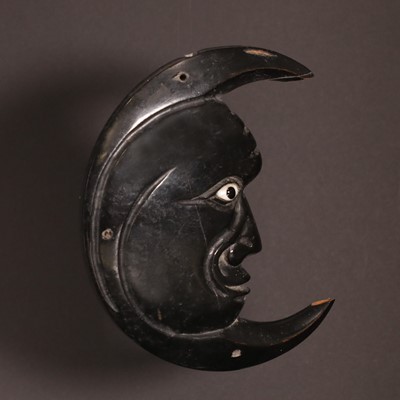 Lot 118 - An unusual ebonised wood plaque