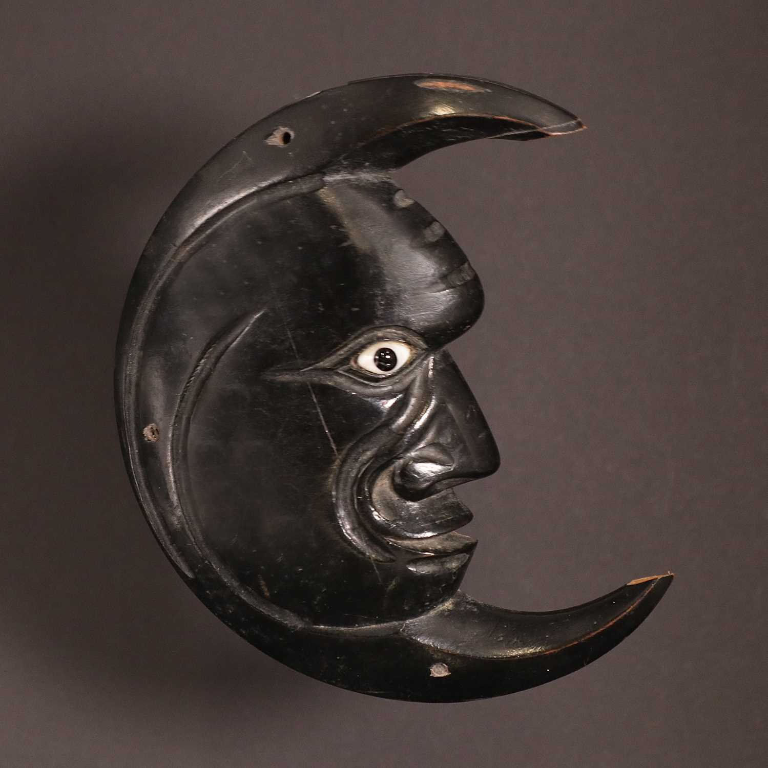 Lot 118 - An unusual ebonised wood plaque