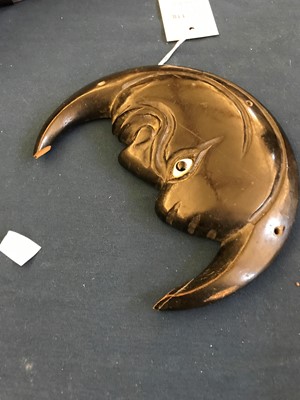 Lot 118 - An unusual ebonised wood plaque