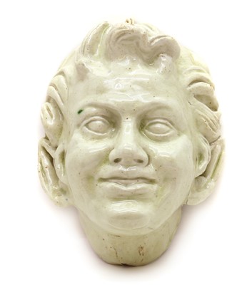 Lot 182 - A glazed ceramic wall mask