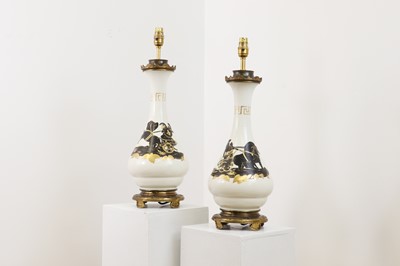 Lot 63 - A pair of gilt-metal-mounted vase lamps