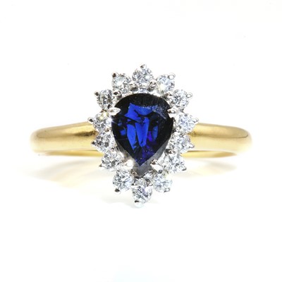 Lot 271 - An 18ct gold sapphire and diamond pear shaped cluster ring