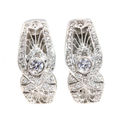 Lot 369 - A pair of white gold diamond set earrings