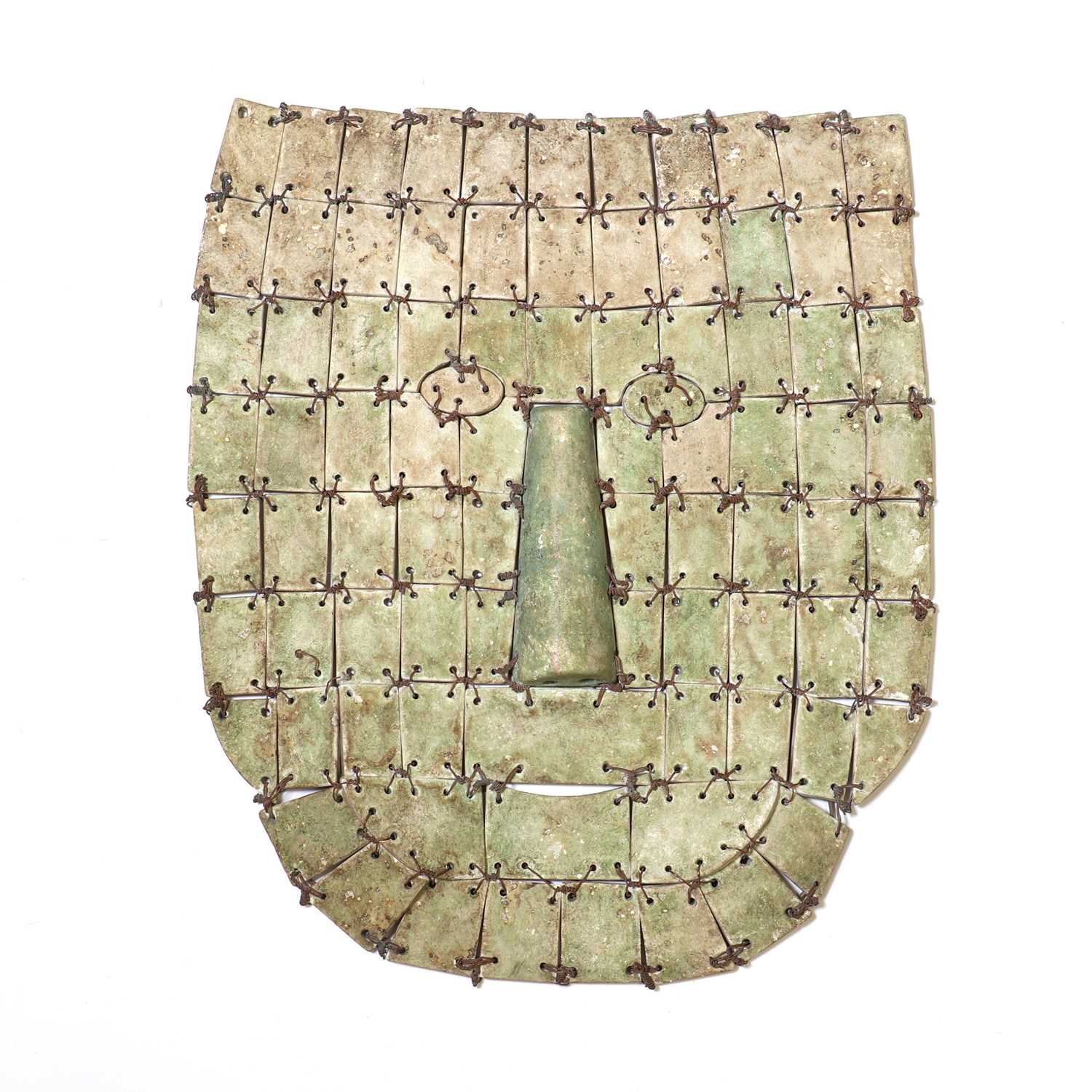 Lot 169 - An archaic Chinese jade or hardstone funerary mask