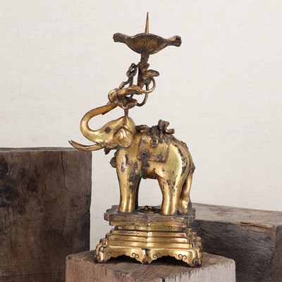 Lot 332 - A Chinese gilt-bronze candlestick