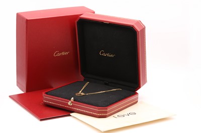 Lot 276 - An 18ct gold diamond set 'Love' necklace, by Cartier
