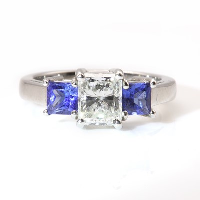 Lot 272 - A three stone diamond and sapphire ring