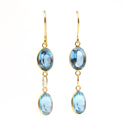 Lot 223 - A pair of gold blue topaz drop earrings