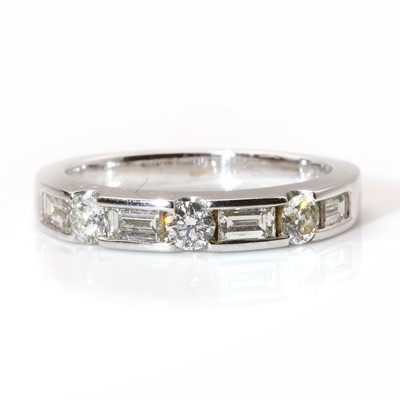 Lot 367 - An 18ct white gold diamond half eternity ring, by Fred Ullmann