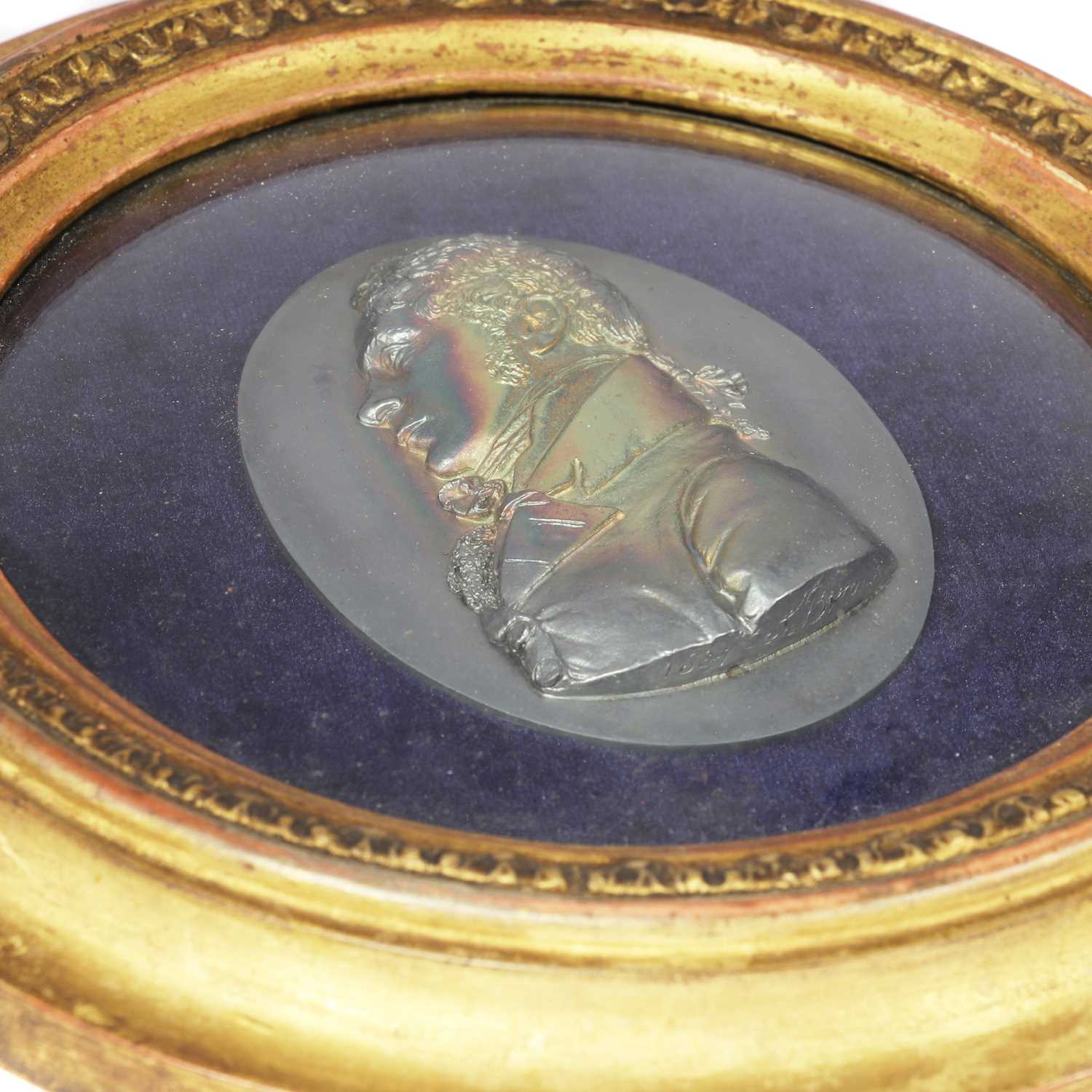 Lot 148 - An oval white metal, possibly silver, medallion