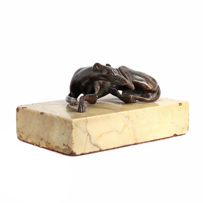 Lot 194 - A Regency bronze figure of a resting greyhound