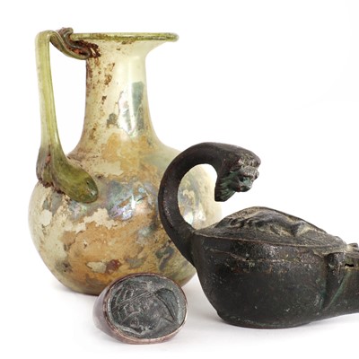 Lot 227 - A small Roman glass vessel