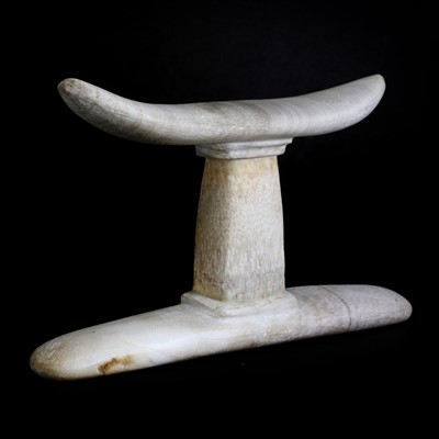 Lot 217 - An Egyptian alabaster or stone headrest