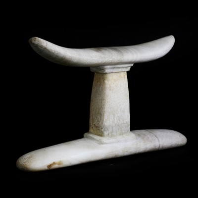 Lot 217 - An Egyptian alabaster or stone headrest