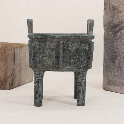Lot 128 - A Chinese bronze ding food vessel