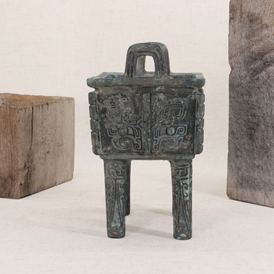 Lot 128 - A Chinese bronze ding food vessel