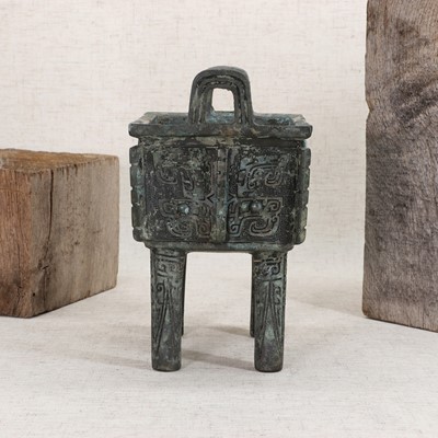 Lot 128 - A Chinese bronze ding food vessel