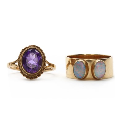 Lot 209 - A 9ct gold two stone opal ring