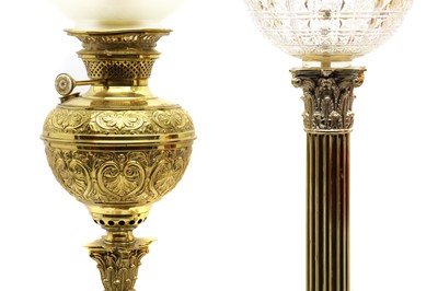 Lot 215 - A group of three Victorian brass table lamps