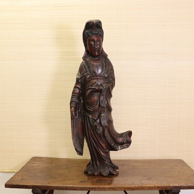 Lot 173 - A Chinese lacquered wood guanyin