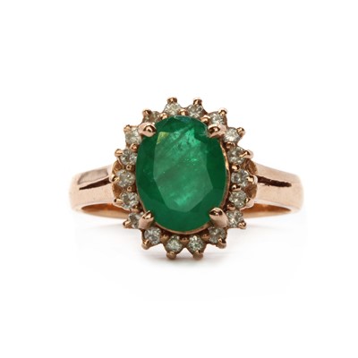 Lot 131 - A 14ct rose gold fracture filled emerald and diamond cluster ring