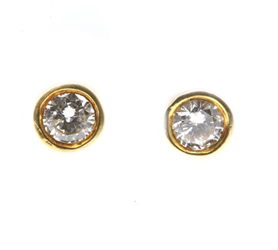 Lot 307 - A pair of gold single stone diamond stud earrings