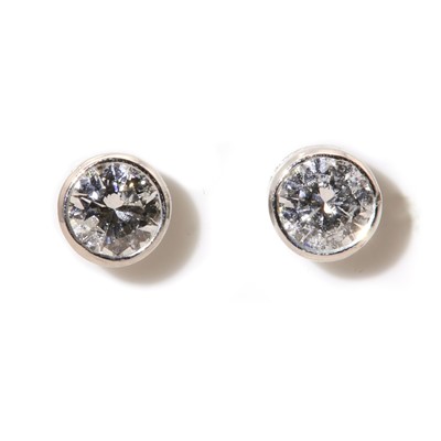 Lot 308 - A pair of white gold single stone diamond stud earrings