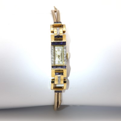 Lot 137 - An Art Deco ladies' 18ct gold diamond and synthetic sapphire set cocktail watch