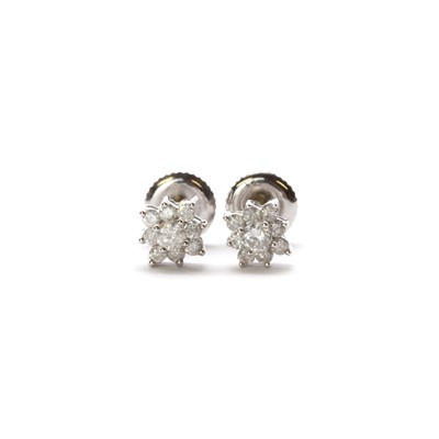 Lot 1171 - A pair of white gold diamond cluster earrings