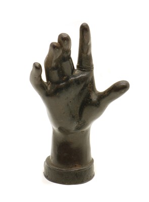 Lot 246 - A bronze hand paperweight or ring stand